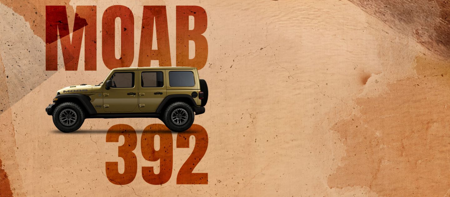 A driver-side front angle of a drab olive green 2026 Jeep Wrangler Moab 392. Moab 392.
